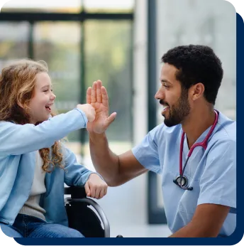a girl giving her doctor a high five
