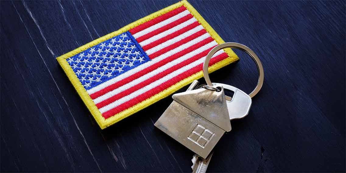 American flag with keys to home.