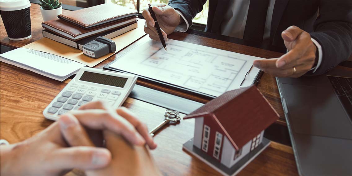 Loan officer discussing home equity.