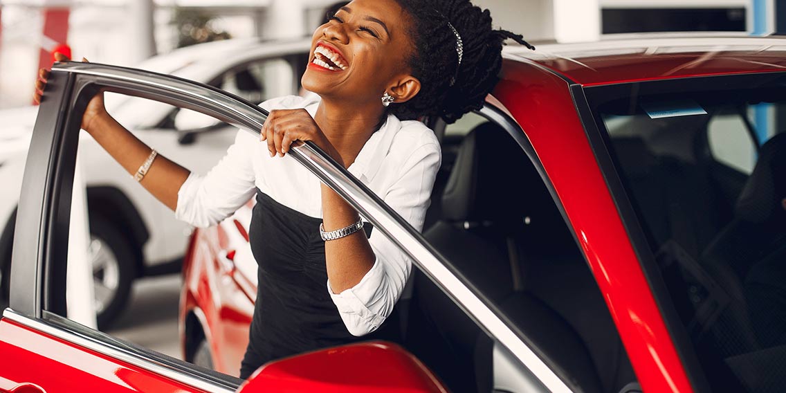 woman buying car of dreams