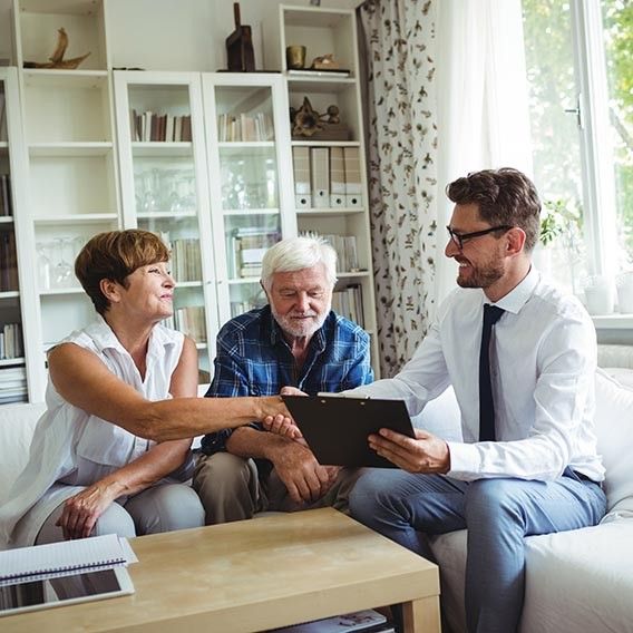 financial advisor shaking hands with one of his clients