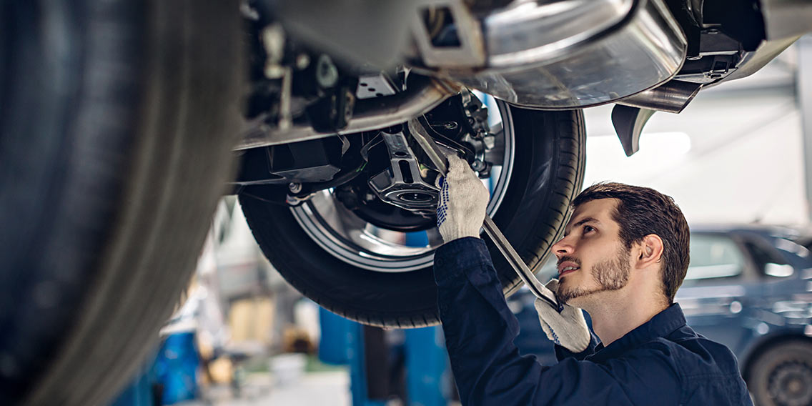 man working on car