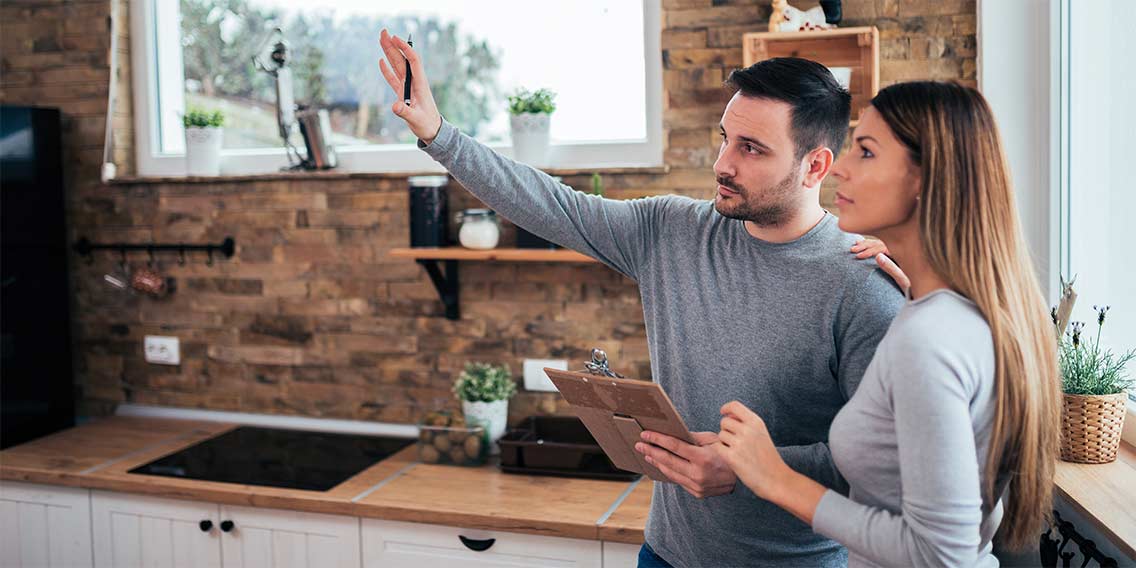 Couple discussing home improvements