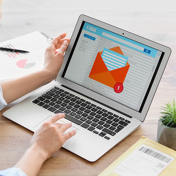 someone looking at phishing email