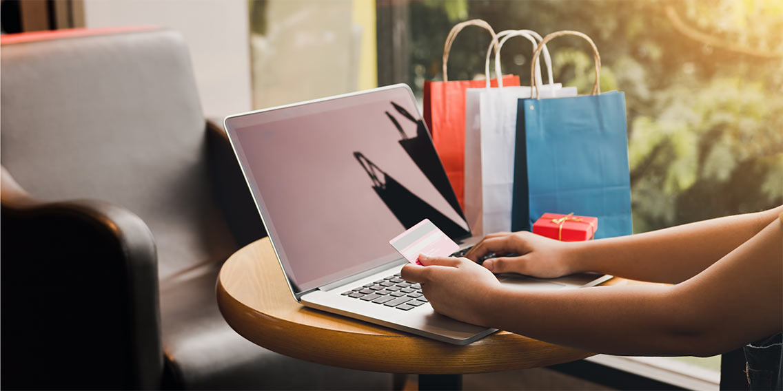 someone using rewards card for shopping