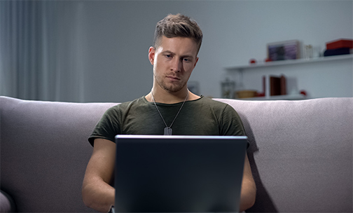 man looking at computer