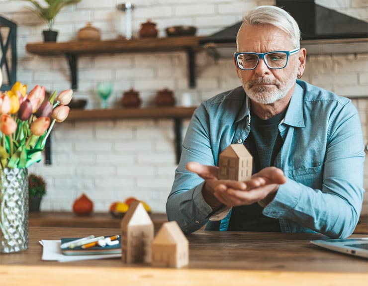 man deciding to refinance home