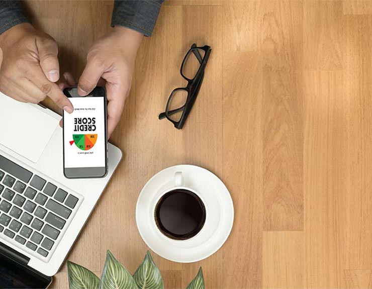man researching credit score on mobile phone