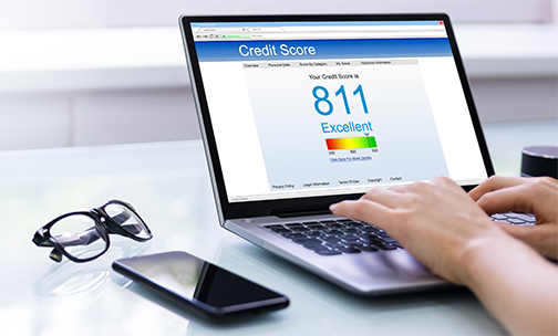military personnel with daughter in front of home