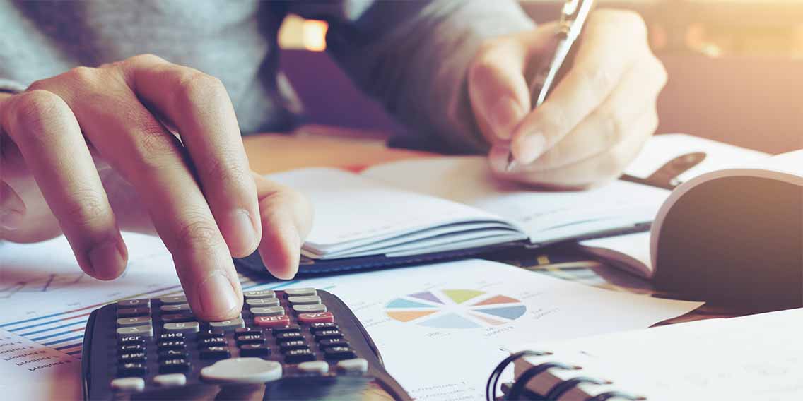 calculator and paper on table