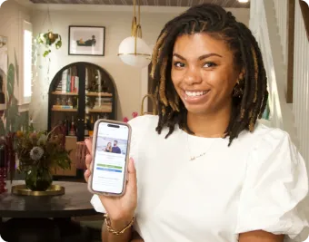  Woman holding the phone and showing the screen