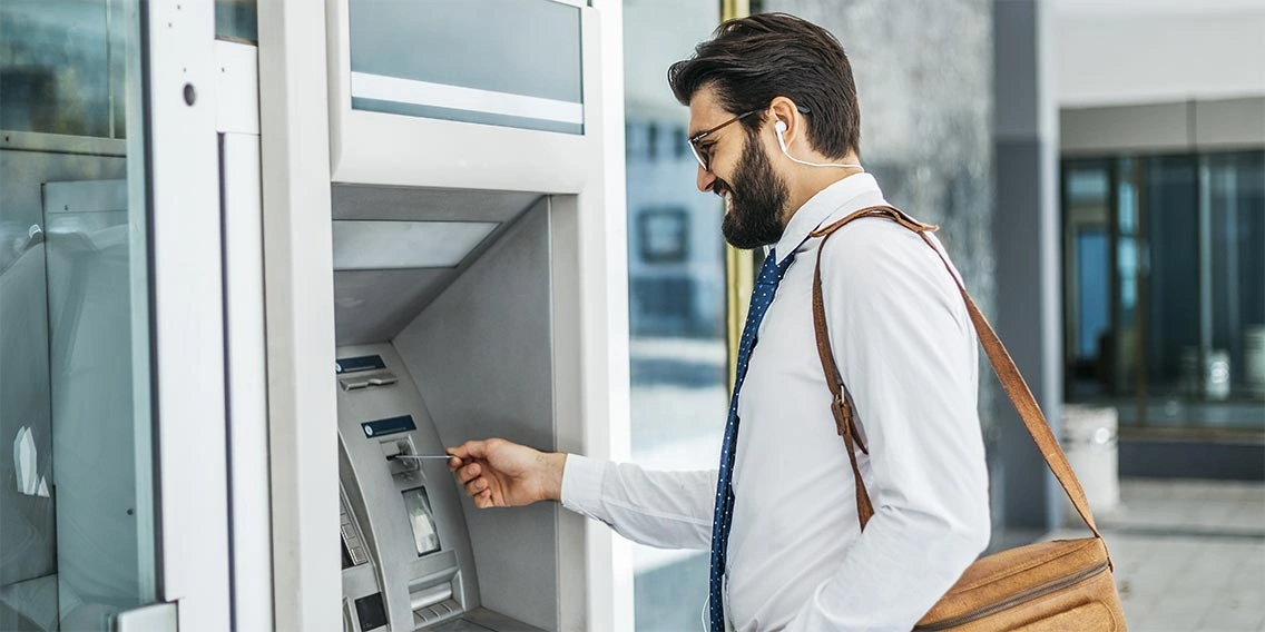 man using ATM