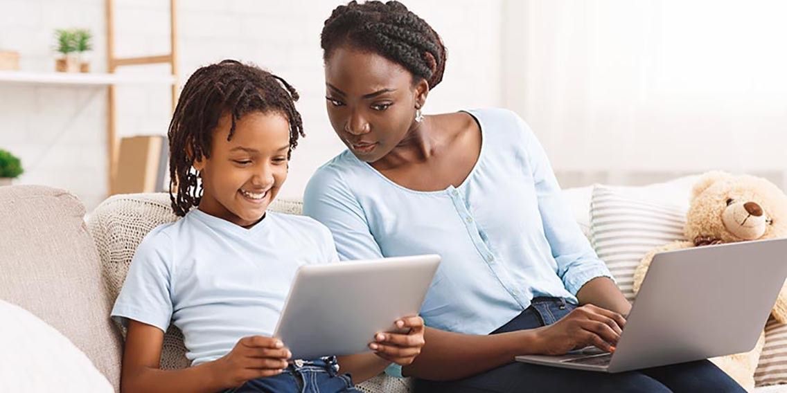 mother and child looking at a tablet