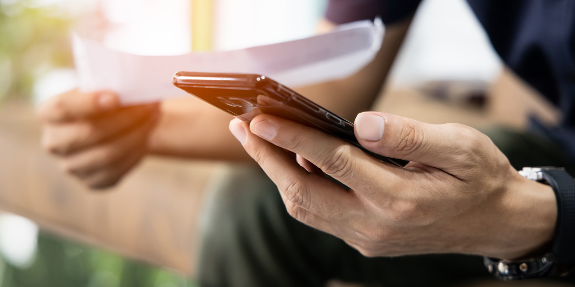 man looking into phone