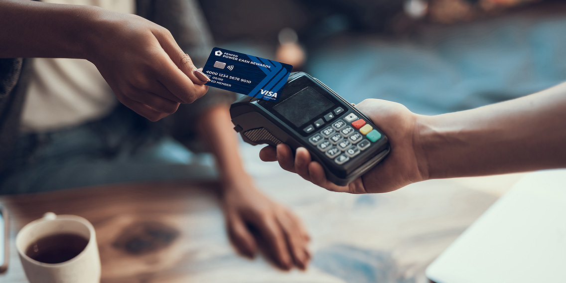 woman paying with EMV chip-enabled debit card