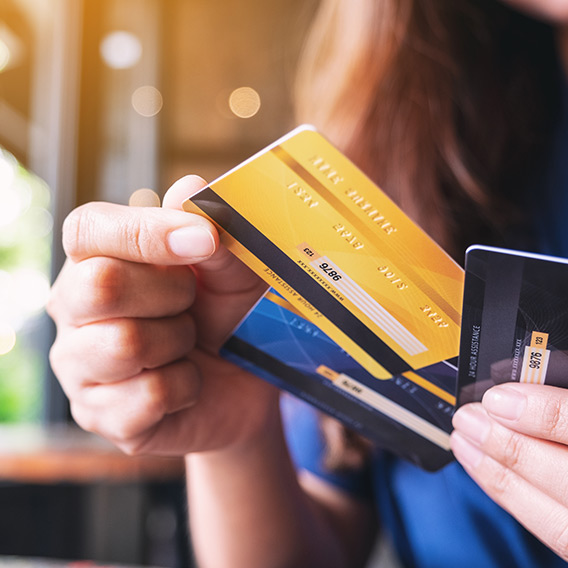 woman paying with EMV chip-enabled debit card