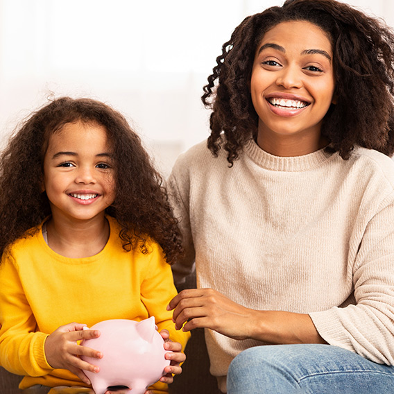 Mom and daughter smiling