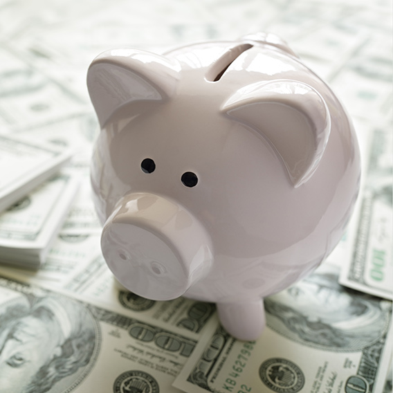money into a piggy bank