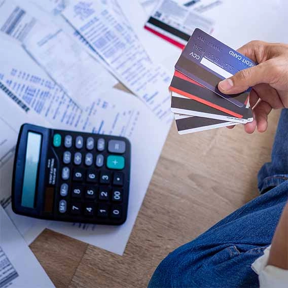person calculating credit card bills