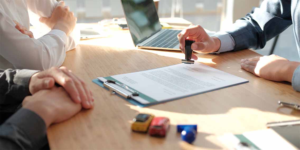 a man stamping the paper