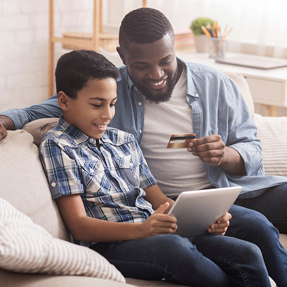 older couple on couch with tablet