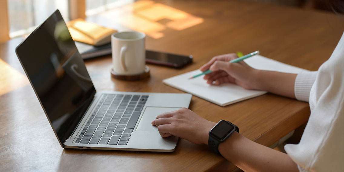 woman researching VA loans on laptop
