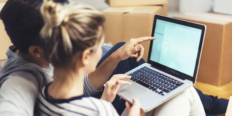 couple looking at a laptop together