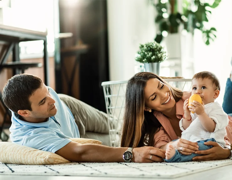 Parents playing with their baby.