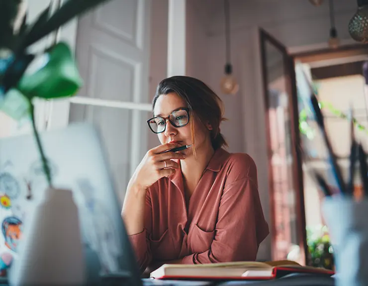 woman thinking at computer