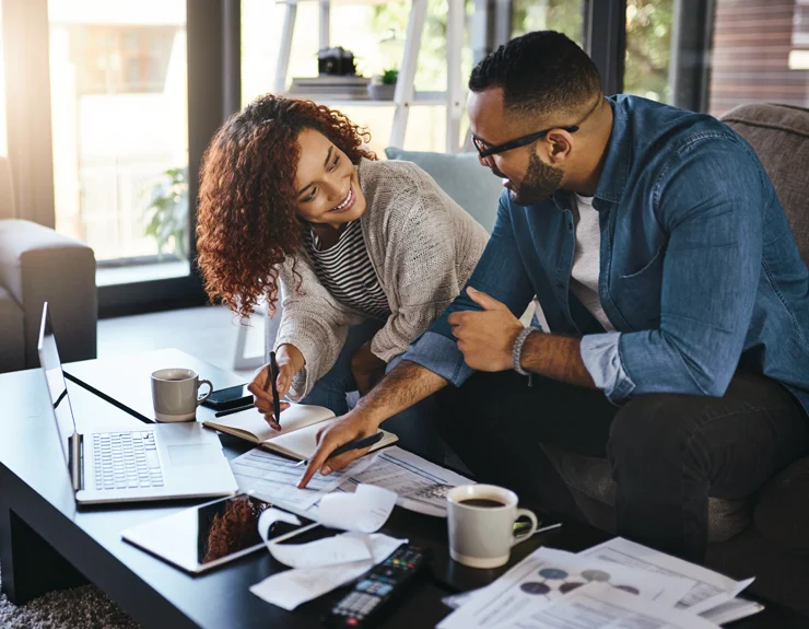 young couple having discussion behind the coffee table
