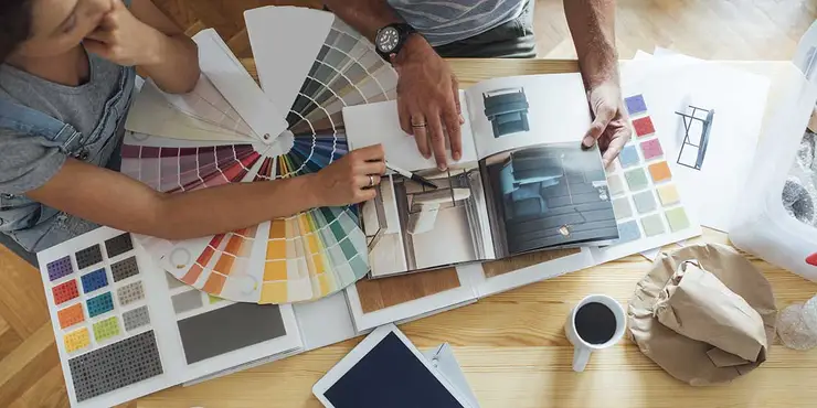 couple discussing home renovations and paint colors