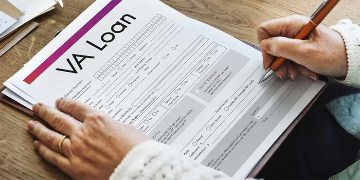 Somone filling out a VA loan application.