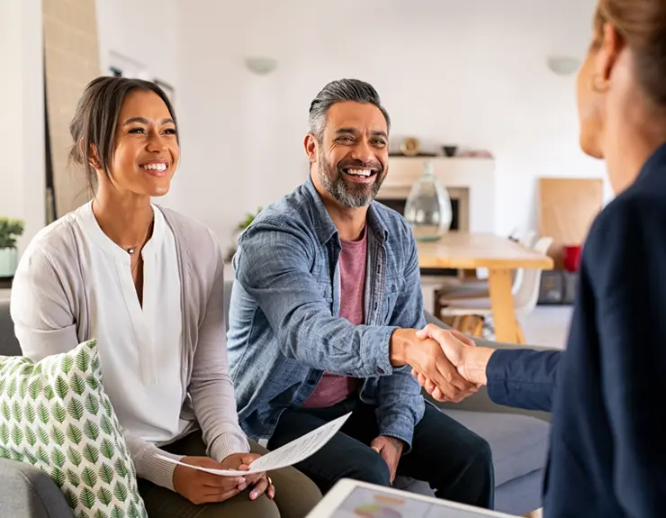 Couple in discussion with a real estate agent