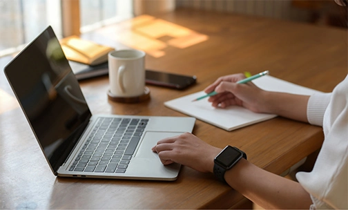 woman researching VA loans on laptop