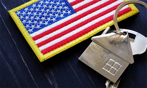 American flag with keys to home.