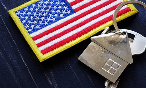 American flag with keys to home