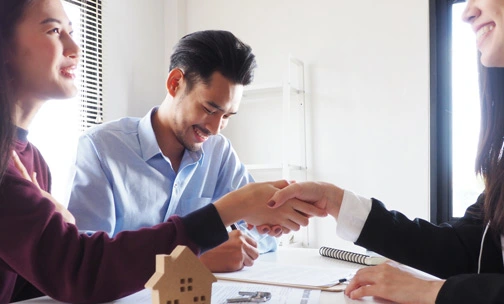 military personnel being handed keys to new home