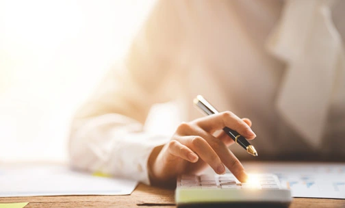 military personnel with daughter in front of home