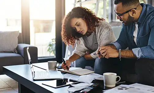 a woman painting her interior home wall blue