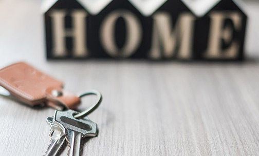 Toy wooden house and scarf.