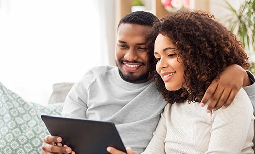 couple looking at tablet