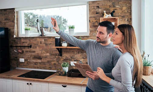 someone on tablet looking at home improvements