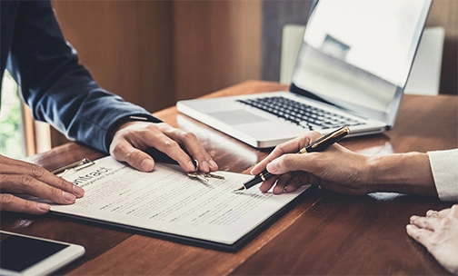 two people going over a mortgage insurance contract