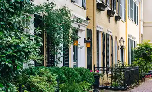 couple unpacking and looking out window of home