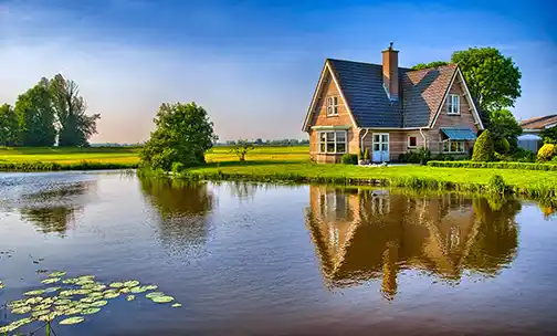 couple looking at a house on a laptop