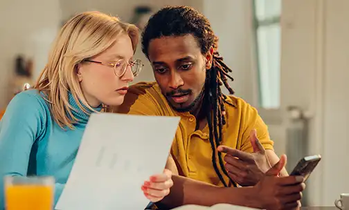 couple looking at document