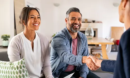 Hands holding house and change