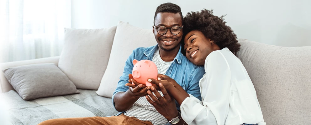 couple holding piggy bank