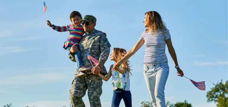 A family holding flag