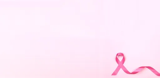 The pink ribbon with light pink background, symbol for breast cancer awareness.